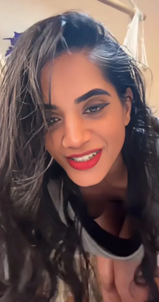 Slim Indian Girl Bent Over Showing Her Small Tits Through Loose T-Shirt